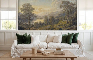 Mountain lake landscape wall mural with rolling hills, ancient trees, and serene water views in a modern living room