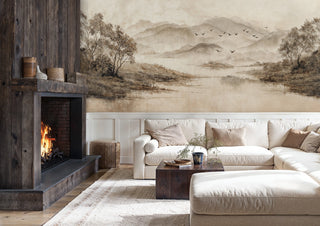 Mountain landscape Wall Mural with misty peaks and flying birds, displayed in rustic living room with stone fireplace