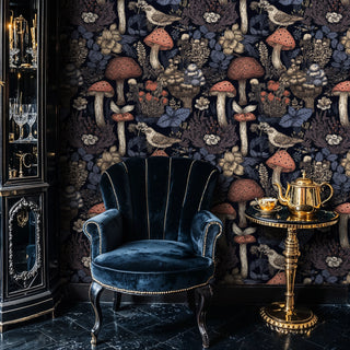 Mushroom and bird wallpaper, navy with rust and beige, shown with velvet chair and teapot