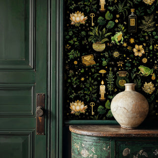 Mystical apothecary wallpaper with golden lotus and green frogs on black, in elegant entryway with antique vase