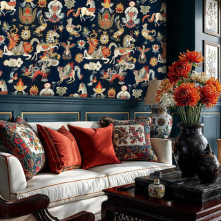 mystical Asian creatures wallpaper with dragons and horses in navy and gold, shown in elegant living room with white sofa