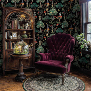 Mystical forest wallpaper showcasing rabbits and botanical elements in an elegant study with burgundy velvet armchair