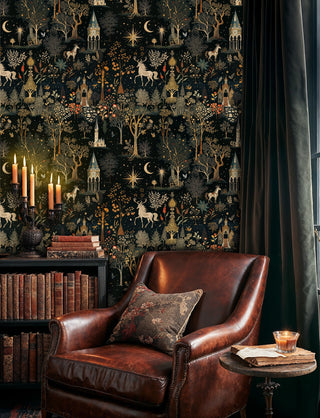 Mystical forest wallpaper with golden details in sophisticated library with leather armchair and bookshelves