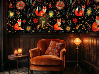 mystical fox wallpaper with celestial starbursts on black background, shown in cozy library with burnt orange chair