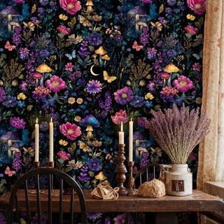 Mystical garden wallpaper featuring colorful wildflowers and butterflies on black, in rustic dining room with candles