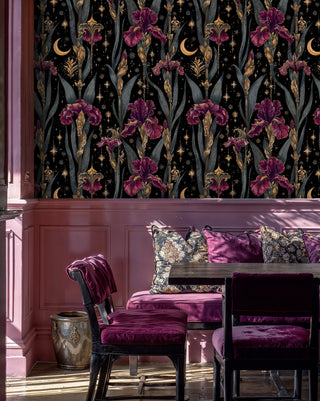 Mystical iris wallpaper in black and purple shown in dining room with burgundy wainscoting and velvet chairs