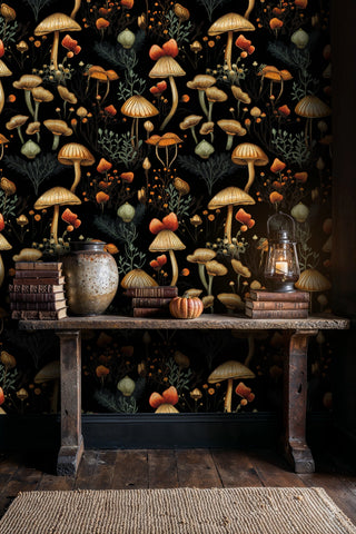 Mystical mushroom wallpaper with golden fungi and sage foliage on black, in rustic entryway with wooden console