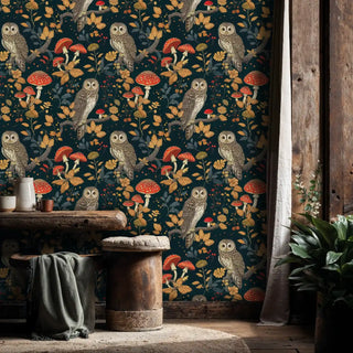 Mystical owl and mushroom wallpaper with autumn botanicals, displayed in a cozy space with wooden furniture