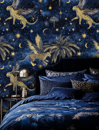 Mystical winged leopards wallpaper with celestial motifs, displayed in bedroom setting with navy bedding and chrome lamp