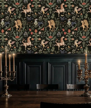 mythical unicorn and botanical pattern with gold and green motifs on black, shown in a dining room with brass candelabra