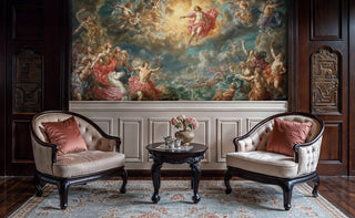 Mythological scene wallpaper in coral and blue tones, featured in classic study with dark wood paneling and armchairs