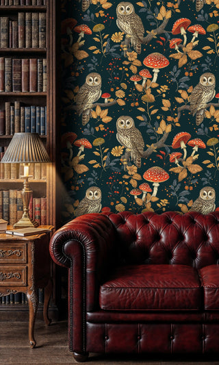 Nature-inspired owl wallpaper with autumn elements in classic library with burgundy chesterfield sofa
