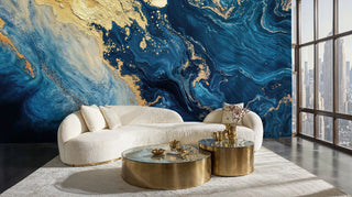 Navy and gold fluid marble wall mural with swirling abstract patterns in a modern living room with curved cream sofa