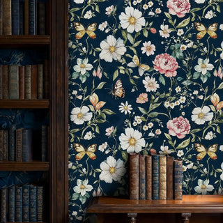 Navy botanical wallpaper with butterfly details, shown in classic library setting with leather-bound books