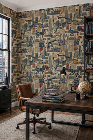 New York City collage wallpaper featuring skyscrapers and street signs in muted tones, shown in a home office with a globe on the desk
