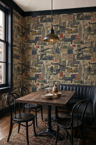 New York City collage wallpaper with landmarks and American flags, in a cafe-style dining nook with an industrial pendant light