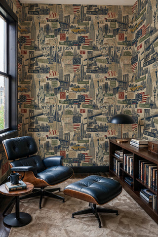 New York collage wallpaper with taxi cabs and skyline in navy and red, in a cozy reading nook with a leather lounge chair