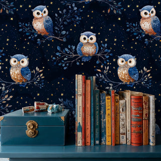 Nocturnal owl wallpaper with celestial stars and branches, displayed alongside vintage books and storage box