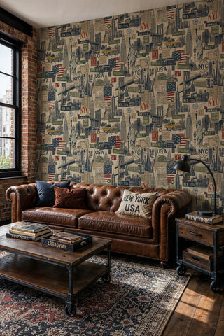 NYC collage wallpaper with landmarks and street signs in an industrial loft with leather Chesterfield sofa