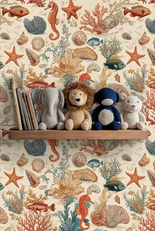 Ocean creatures wallpaper with coral and fish patterns, shown in kids room with stuffed animals on wooden shelf