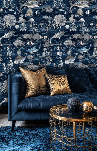Ocean themed wallpaper showing seahorses and starfish, styled in modern living room with blue velvet sofa