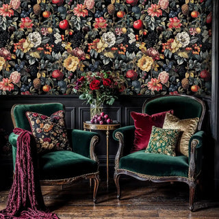 Orchard botanical wallpaper of floral fruit on black, red gold, in lounge with twin green chairs