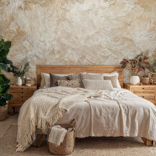 Organic plaster wall mural with subtle cracks and aging, displayed in serene bedroom with woven baskets