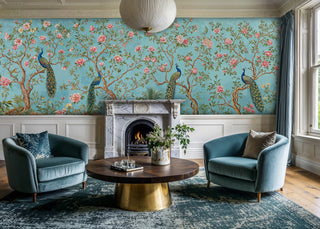 Oriental bird and flower wall mural in turquoise and pink, shown in living room with marble fireplace