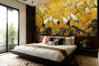 Oriental crane wall mural in gold and white, in a modern bedroom with platform bed and floor-to-ceiling window