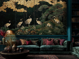 Oriental crane wallpaper with botanical details, shown in living room with teal velvet sofa