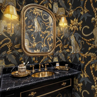 Ornate leopard and rope wallpaper design, featured in luxurious powder room with brass fixtures and vintage mirror