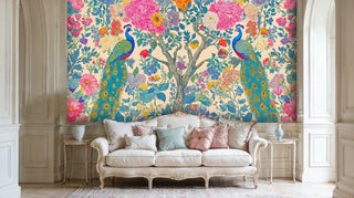 Ornate peacock garden wall mural with rich florals, shown in elegant French-style room with carved white sofa
