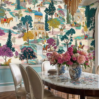 Palace garden mural with riders and domes in teal and beige, shown with gold chandelier