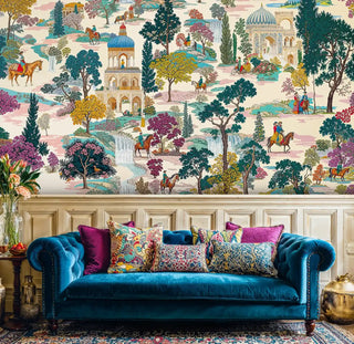 Palace garden mural with riders and trees in teal and beige, shown with a teal velvet sofa