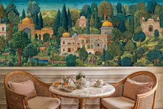 Palace landscape wall mural featuring ornate buildings and wildlife, shown in cozy breakfast nook with marble table