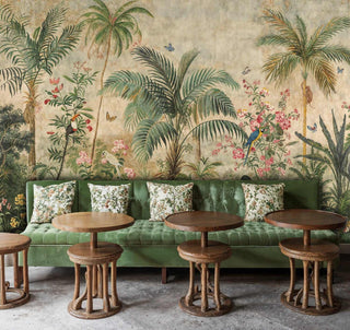 Paradise wallpaper with exotic birds and tropical plants, displayed in cafe setting with green banquette seating
