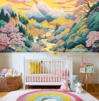 Pastel mountain landscape wall mural with cherry trees in serene nursery with white wooden crib