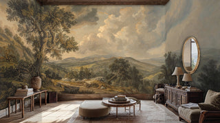 Pastoral landscape wall mural showing rolling countryside and dramatic sky, featured in elegant room with ottoman