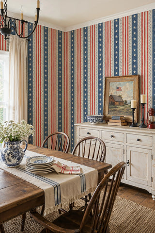 Patriotic striped wallpaper with stars and scallop trim in a rustic dining room with Windsor chairs