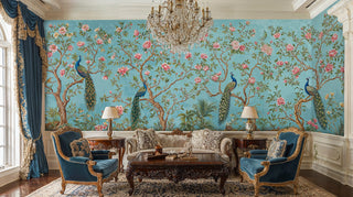 Peacock garden wall mural featuring ornate birds and blooms, displayed in formal living room with crystal chandelier