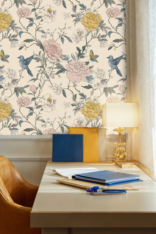 Peony and bluebird wallpaper on cream background, in a study with leather chair and blue folders
