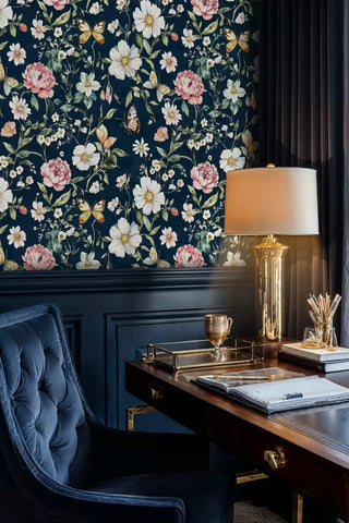 Peony and butterfly wallpaper in navy and coral, displayed in sophisticated home office with brass accents