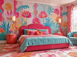 Pink and teal watercolor floral wall mural with golden accents in a vibrant bedroom with scalloped headboard