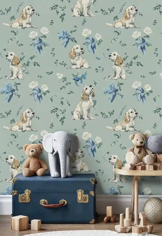 Playful spaniel wallpaper with cream roses and foliage, displayed in nursery with blue vintage trunk