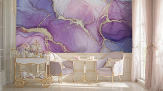 Purple marble wall mural with gold veins and pink ink washes in an elegant tea room with gold cart