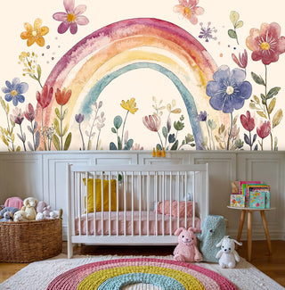 Rainbow garden wall mural featuring soft pastels and botanical elements in a white nursery with wicker basket
