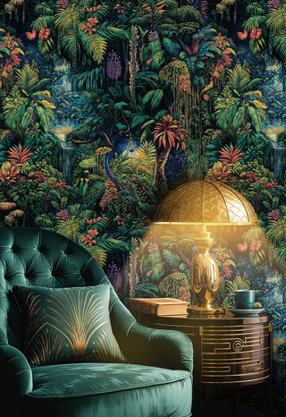 Rainforest wallpaper with dense greenery and cascading vines, in a lounge with tufted green armchair and gold lamp