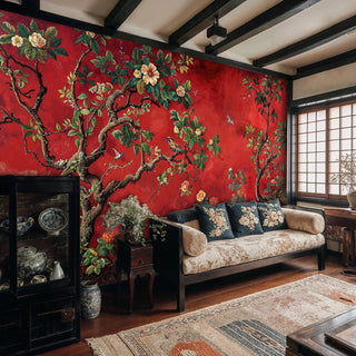 Red chinoiserie wall mural featuring songbirds and blooms displayed in rustic living room with exposed beams