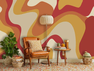 Retro abstract wallpaper with curved patterns in cozy reading nook with leather armchair