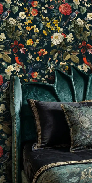 Rich floral wallpaper featuring birds and blooms, displayed in sophisticated sitting area with teal velvet chair